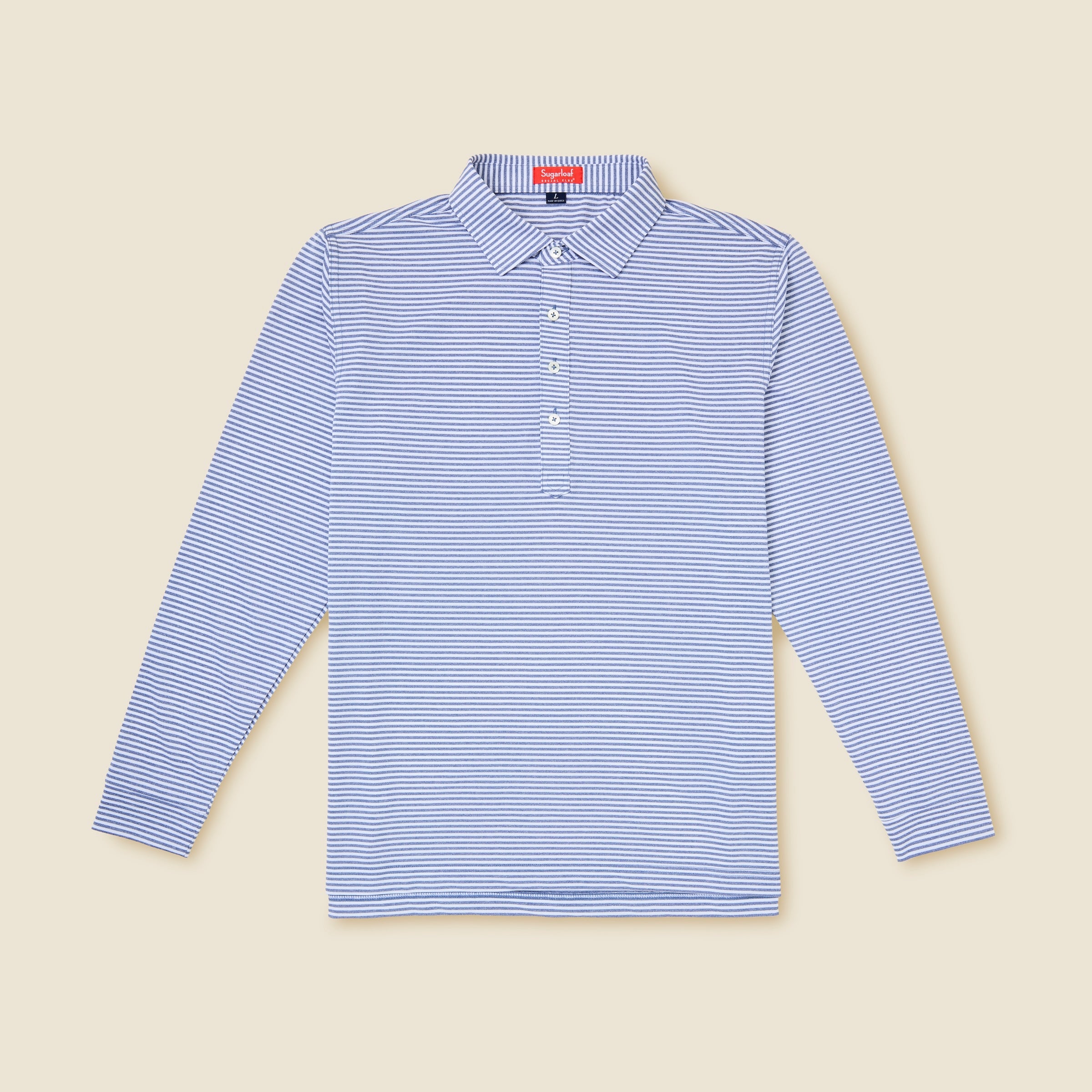 A long-sleeve polo shirt with fine blue and white horizontal stripes, featuring a classic collar and a three-button placket, laid flat against a solid beige background.